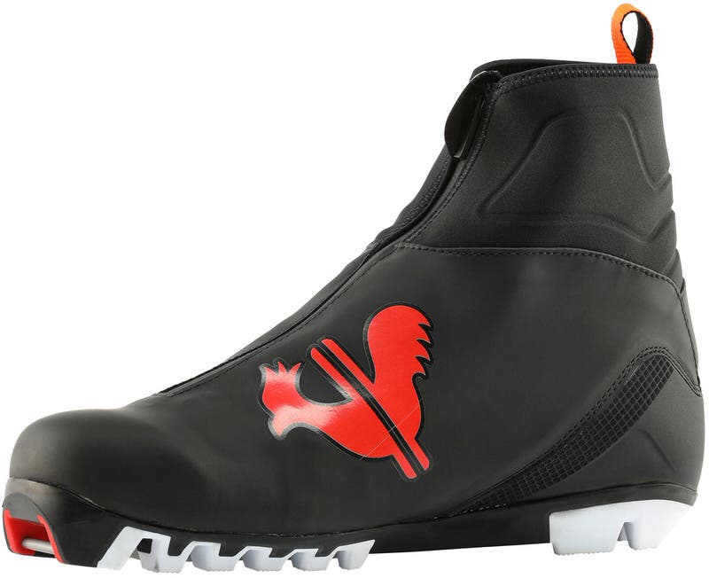 Schwarzer Rossignol X10 Classic Langlaufschuh mit rotem Hahn-Logo, seitliche Ansicht.