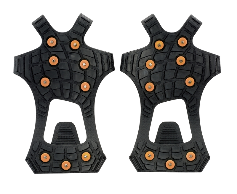 Zwei schwarze Sidas Walk Traction Schuhkrallen mit Spikes liegen nebeneinander vor einem weißen Hintergrund.