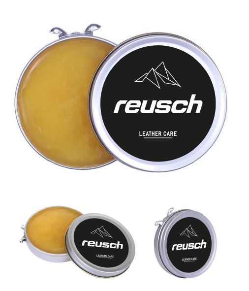 Drei Dosen Reusch Lederpflege, eine geöffnet mit gelblicher Pflegecreme.