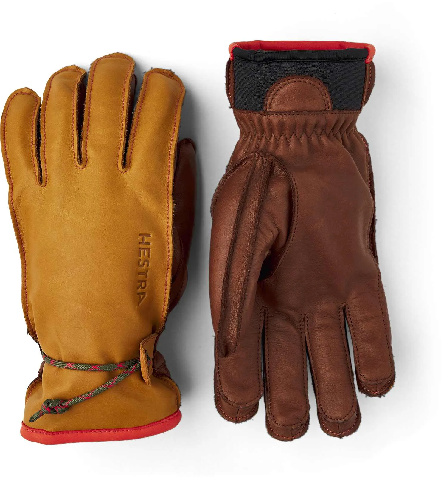 Zwei Hestra Wakayama Handschuhe, braunes und gelbes Leder mit roter Akzentuierung, liegen auf einem weißen Hintergrund.