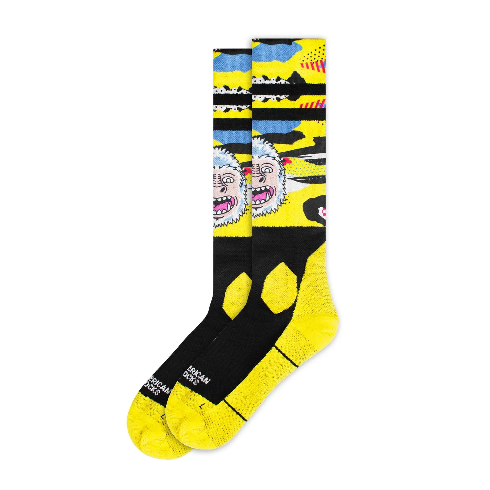 Yellow, knee-length snow socks with Yeti motif, black foot section and cuffs.