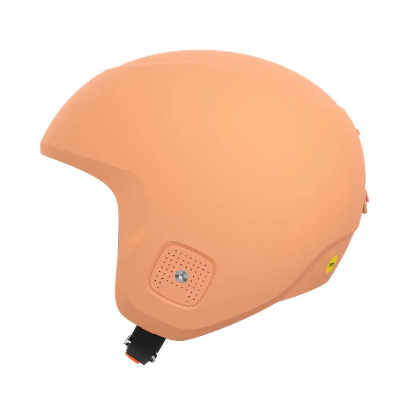 Peach-colored ski helmet in shell construction with ventilation openings and chin strap.