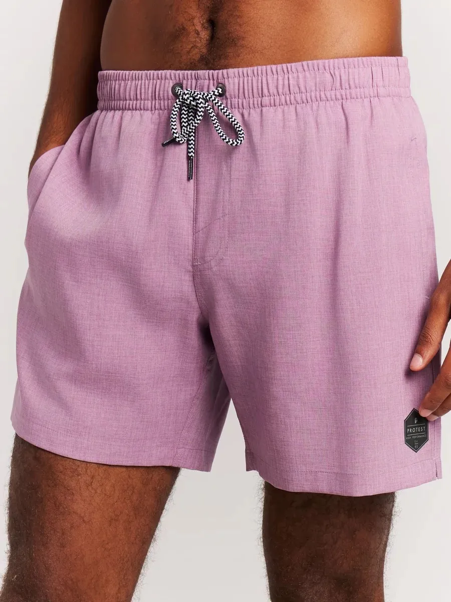 Close-up: person wearing the Protest Daviey beach shorts in Plum Mauve. Detail view of waistband and leg.