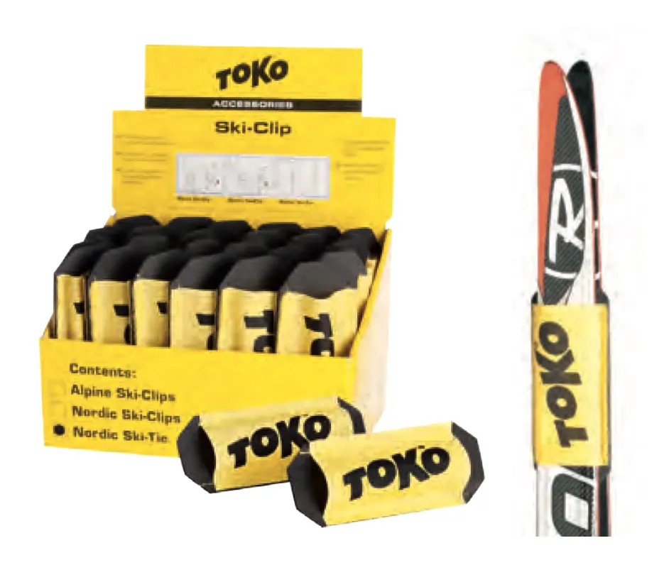 Gelbe Display-Box mit Toko Ski Tie Nordic Clips und ein Paar Langlaufski mit Clip.