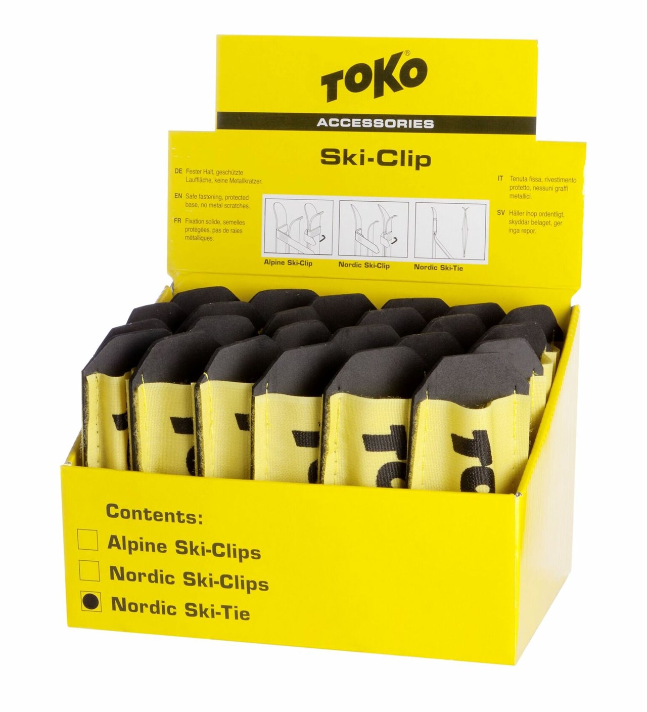 Emballage de vente jaune avec Toko Nordic Ski Ties. Des coussins noirs protègent les semelles des skis.