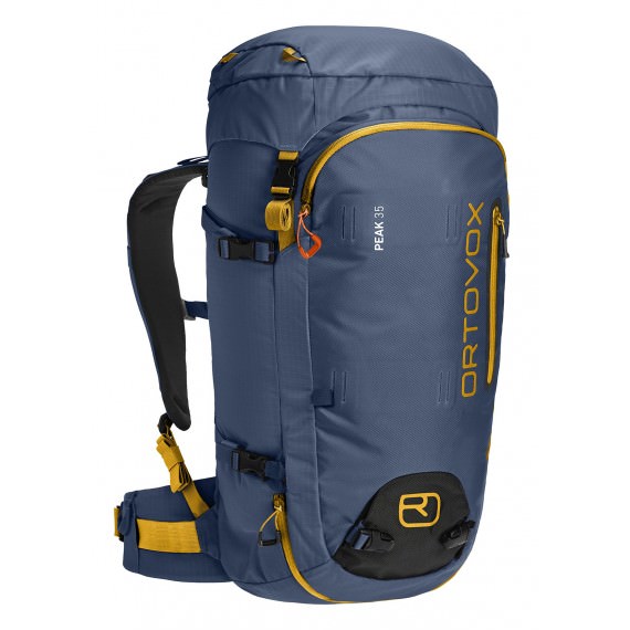 Blauer Ortovox Peak 35 Rucksack mit gelben Akzenten, seitliche Ansicht, Fokus auf Träger, Fächer und Ortovox-Logo.