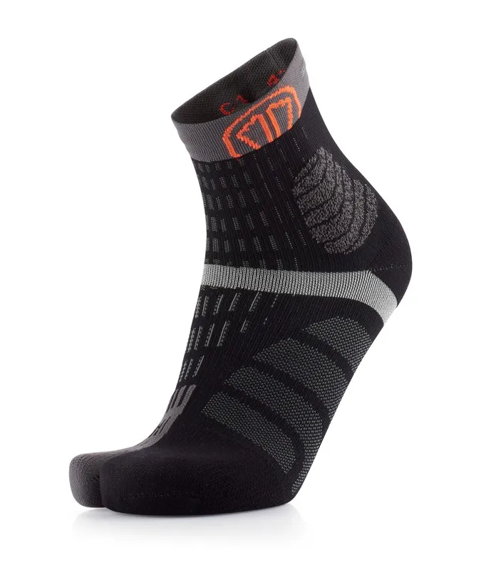 Black-grey sock with toe section and orange logo on the ankle. The sock has textured details.