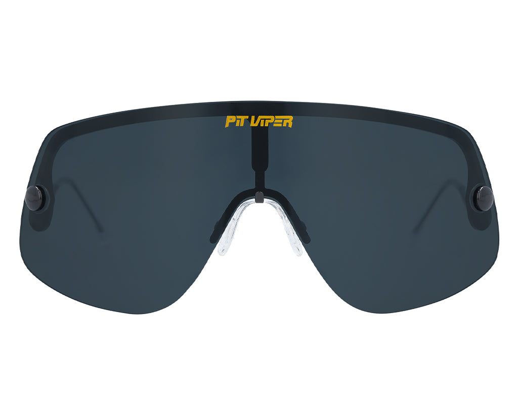 Pit Viper The Exec sunglasses Close-up of the Pit Viper The Exec sunglasses with polarized, dark lenses and yellow logo.