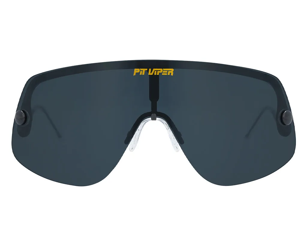 Close-up of the Pit Viper The Exec sunglasses with polarized, dark lenses and yellow logo.