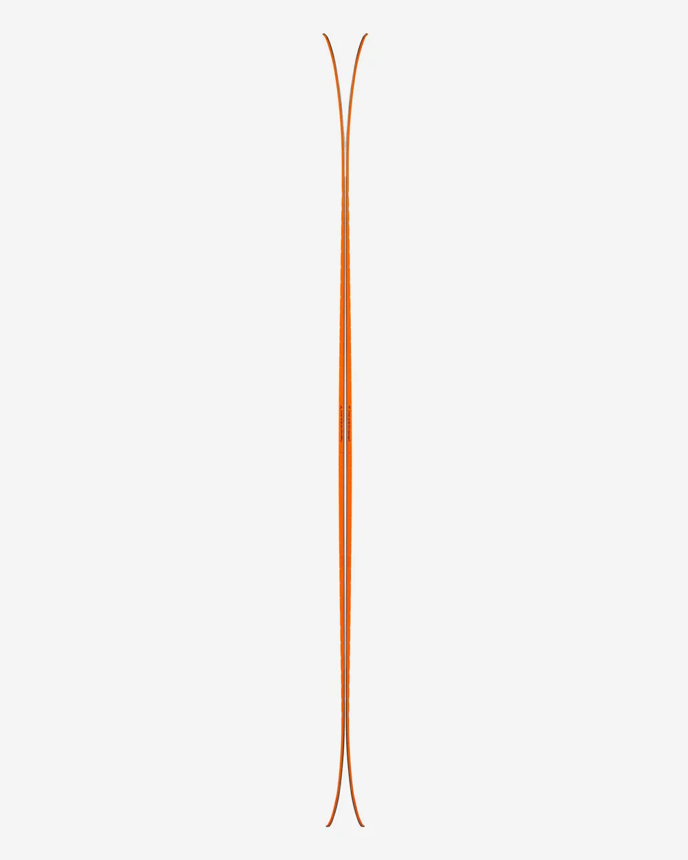 A pair of orange skis, vertically centered on a white background.