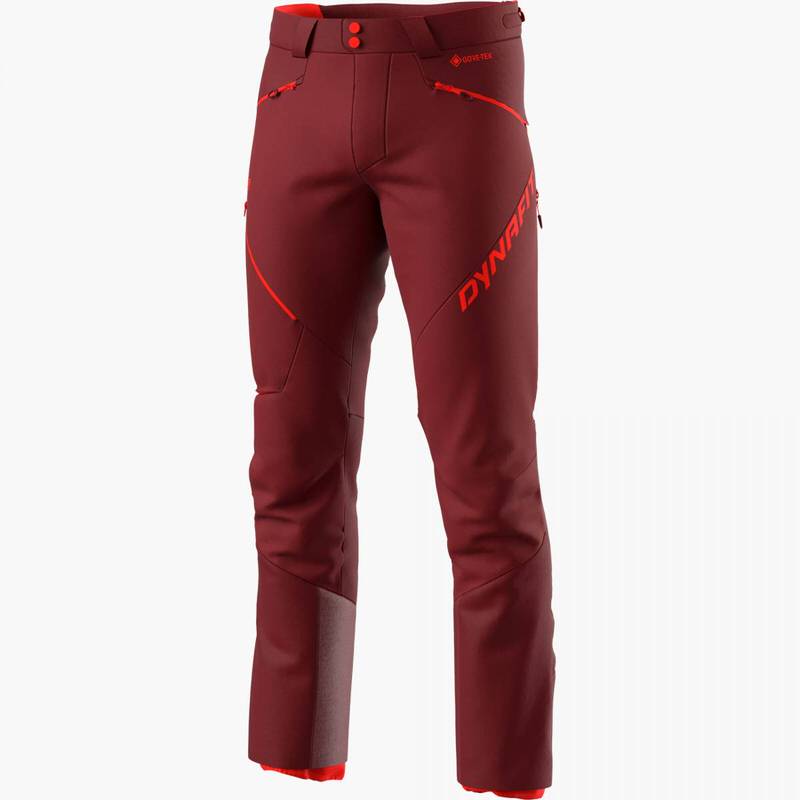Freistehende, rote Dynafit Radical Infinium Hybrid Hose für Herren, mit roten Akzenten und Logos.
