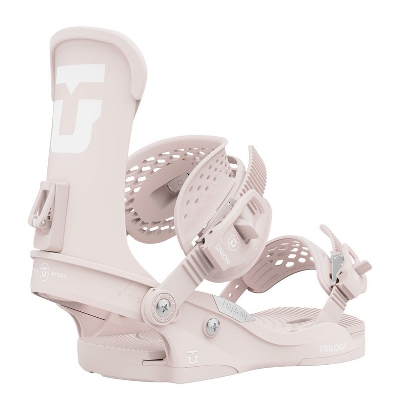 Close-up of a pink Union Trilogy snowboard binding with logo and adjustable straps.