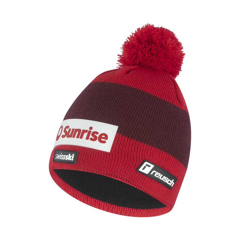 Rot gestreifte Reusch Swiss-Ski Team Beanie mit Bommel und Logos auf weißem Hintergrund.