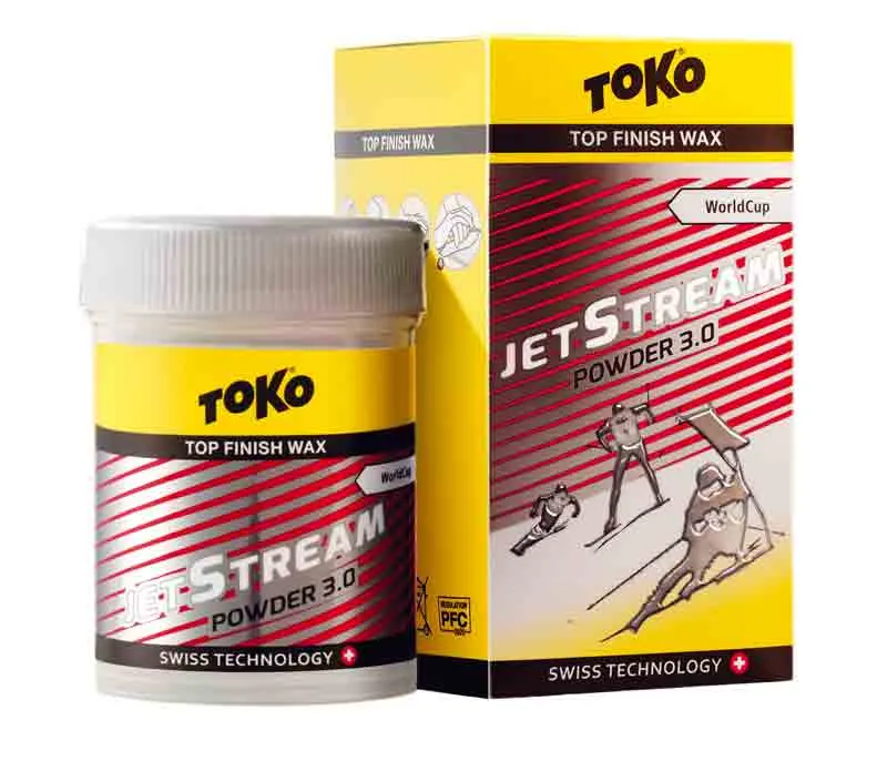 Confezione Toko JetStream Powder 3.0 Red: lattina e scatola con grafica di sciatori in giallo, rosso e argento.