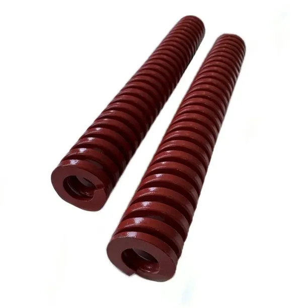 Two identical dark red cylindrical compression springs lie parallel to each other on a white background. Each spring is tightly coiled from thick metal and has a flat, closed surface at each end with a central opening.