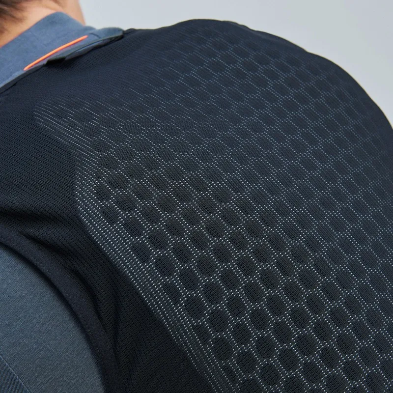 Detailed view of the POC VPD Air Vest in black with honeycomb structure on the back, worn over a shirt.