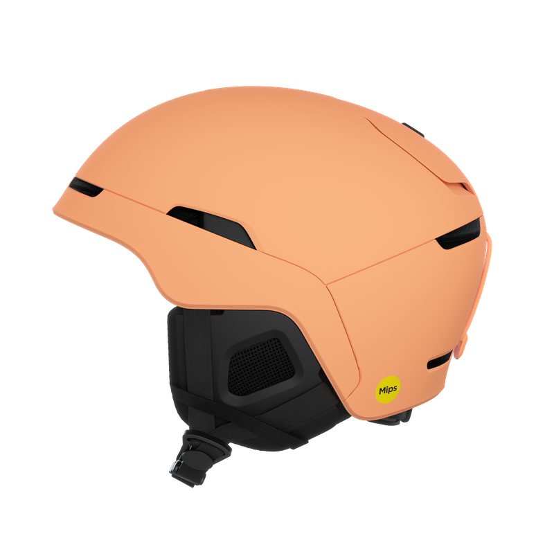 Pfirsichfarbener Skihelm mit schwarzen Akzenten und einem gelben MIPS-Aufkleber.