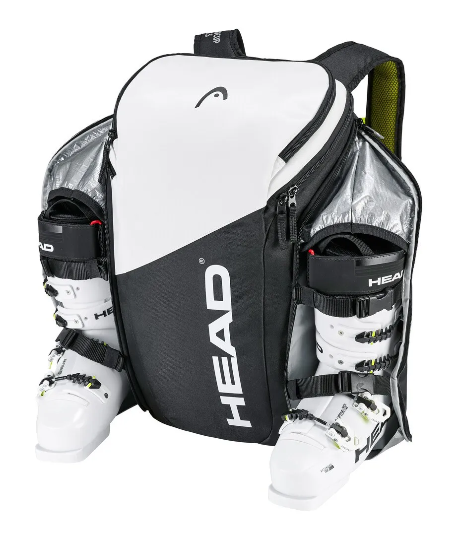 Sac à dos Head Rebels blanc et noir avec chaussures de ski dans des compartiments séparés.