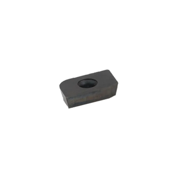 Rectangular, dark carbide side cheek knife with a bevel, radius and a hole.