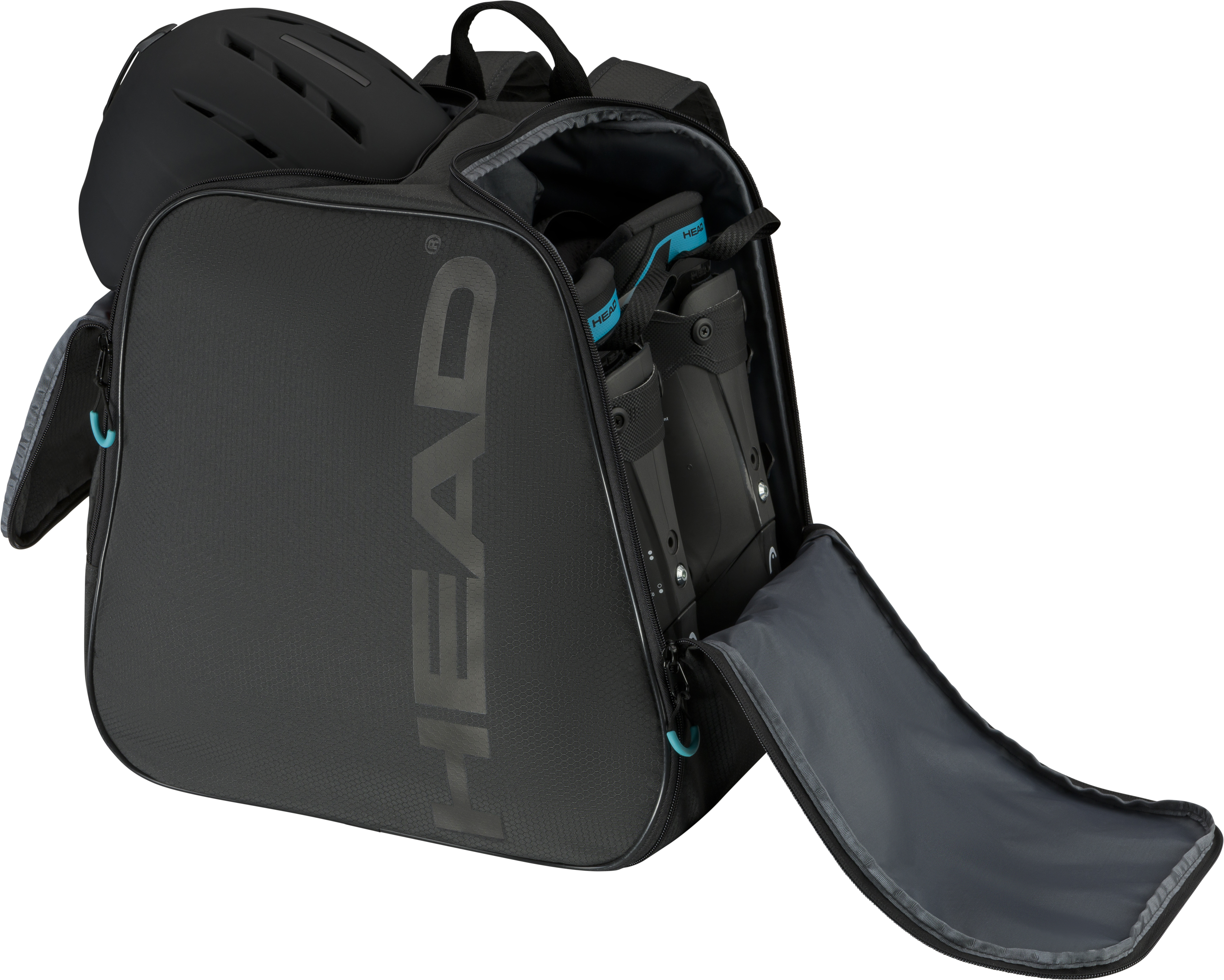 Sac à dos Head Boot noir avec casque et chaussures de ski. Le sac a des compartiments ouverts.