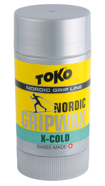 Toko Nordic GripWax X-Cold in Drehverpackung, gelb mit Skifahrer-Logo. Haftwachs für Langlaufski.