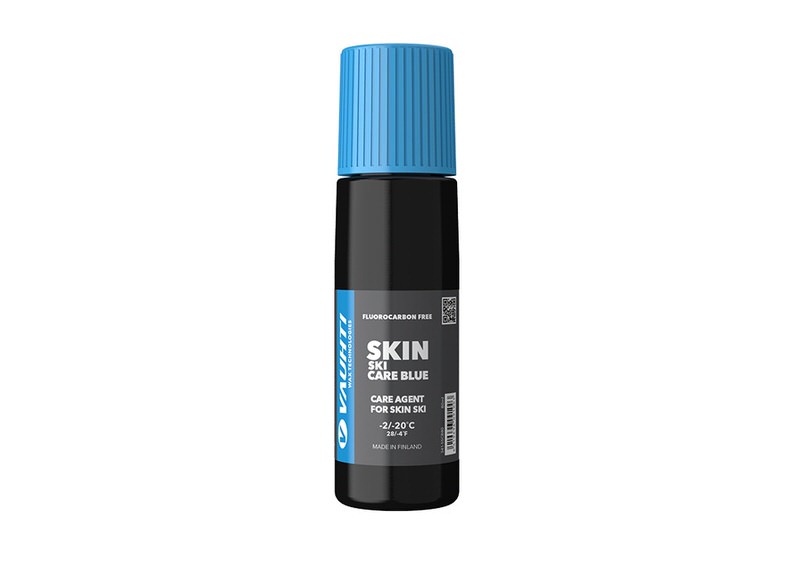 Schwarze Flasche Vauhti Skin Care Blue Flüssigwachs mit blauem Deckel für Ski, mit Produktinformationen.