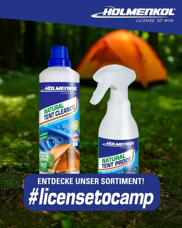 Two bottles of Holmenkol tent care products in front of a fuzzy orange tent in the forest, including a cleaner and a waterproofing spray.