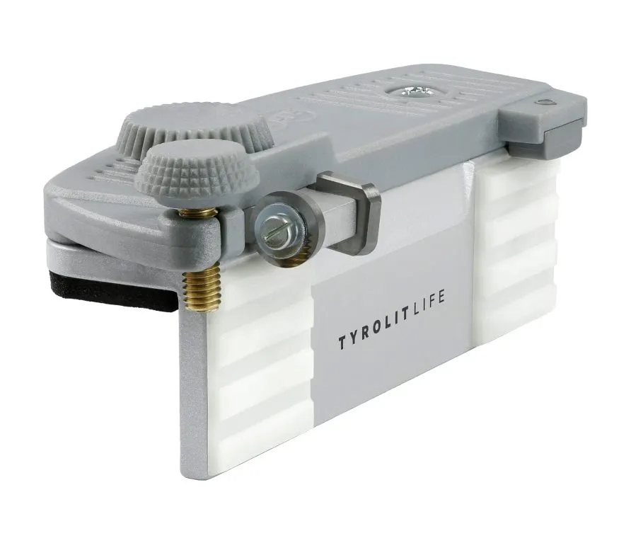 Gray tool with knurled screws and the lettering "TYROLITLIFE" on a white background.
