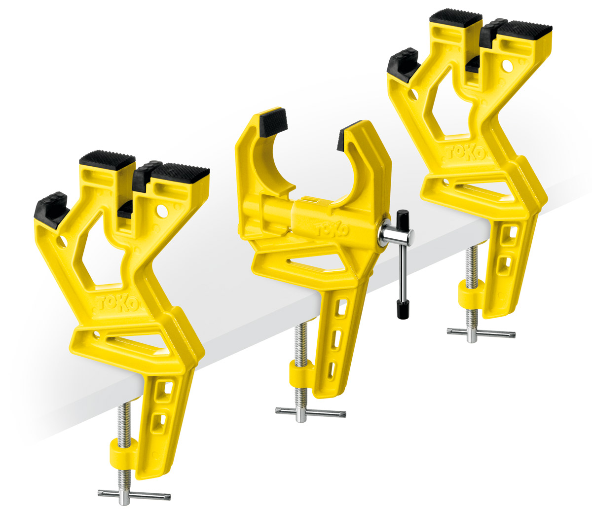 Gelbe Toko Ski Vise Race, ein 3-teiliges Einspannsystem für Alpinski, an einer Tischplatte befestigt.