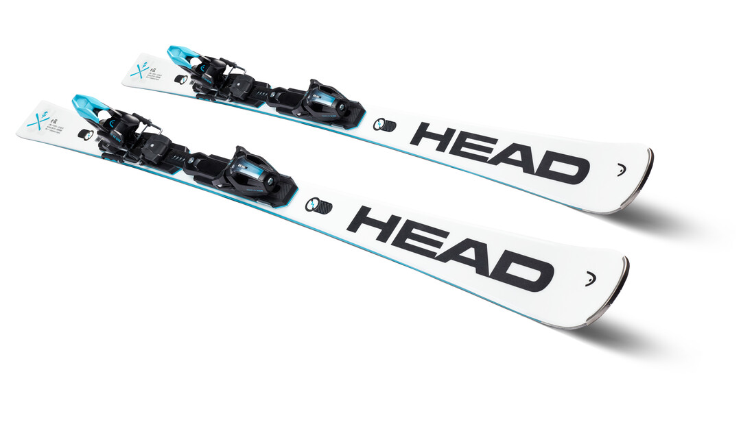 White Head Worldcup Rebels e-SL skis with bindings lie parallel on a white base.