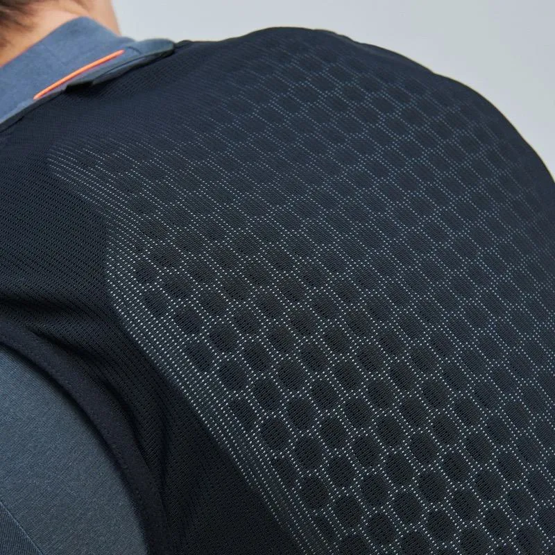 Detailed view of the POC VPD Air Vest in black with honeycomb structure on the back, worn over a shirt.