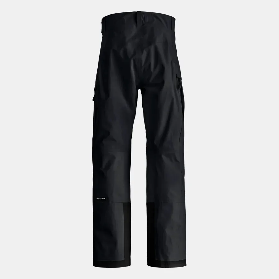 Black, long trousers with a high waist and patch pockets. The trouser legs are reinforced at the bottom.