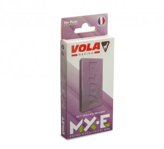 Packaging of the purple Vola MX-E no Fluor ski wax. The wax itself is also visible.