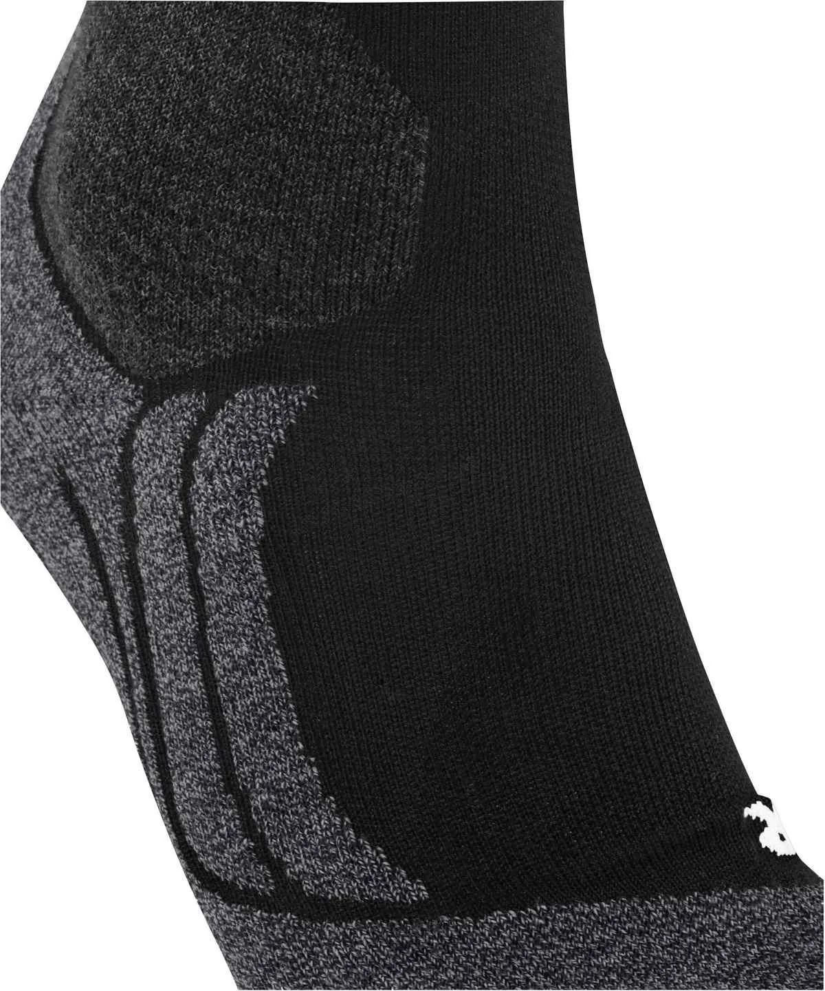 Close-up of a black sports sock with gray textured elements: a dark, hexagonal knit pattern in the upper left corner, and three parallel light gray ribs on the top of the foot. Fine black fabric, small white logo in the lower right corner.