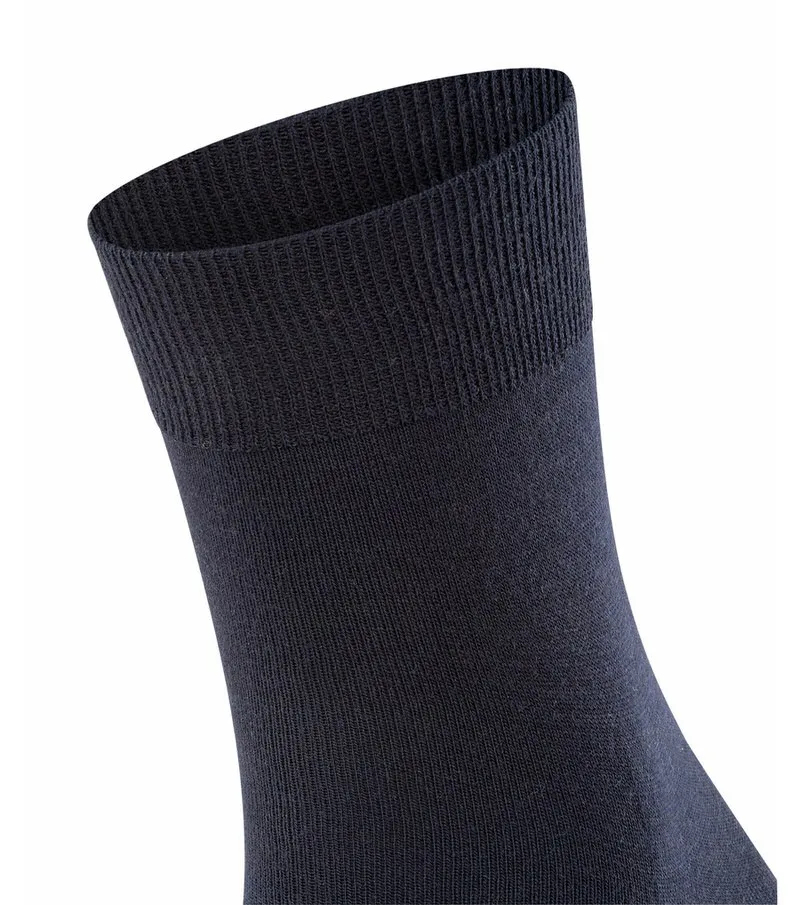 Close-up of a dark blue men's sock with ribbed cuffs.