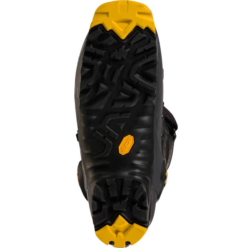 Die Unterseite vom La Sportiva Vega Man Skitourenschuh in Schwarz mit gelber Vibram Sohle ist von unten zu sehen.