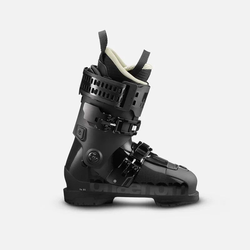Black ski boot with buckles, straps and a beige inner boot that sticks out at the top.