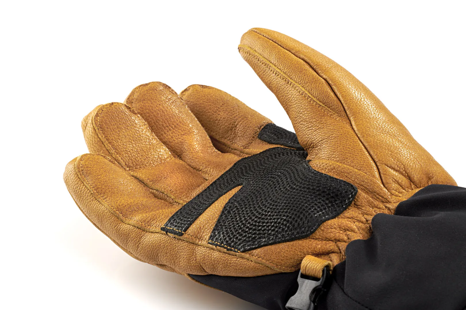 Nahaufnahme eines braunen Therm-ic Freeride Ultra Heat Handschuhs mit schwarzer Verstärkung auf der Handfläche.