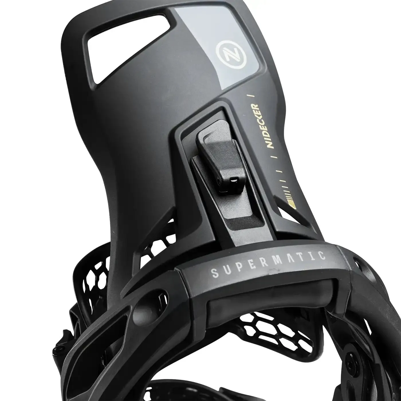 Close-up of a black snowboard binding with grid pattern and the lettering "SUPERMATIC".