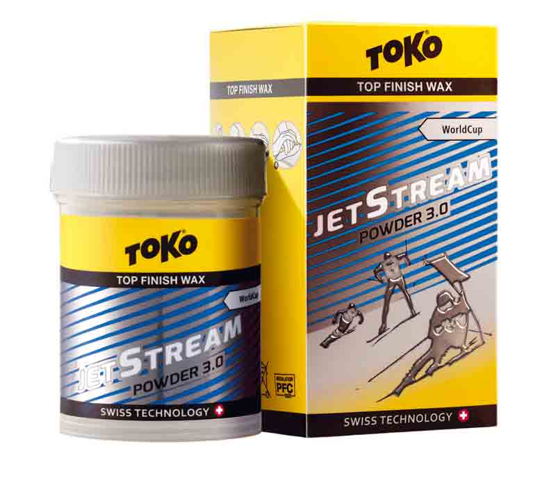Gelbe Dose und Verpackung von Toko JetStream Powder 3.0 Blue Skiwachs mit Skifahrer-Illustration und blauem Streifendesign.