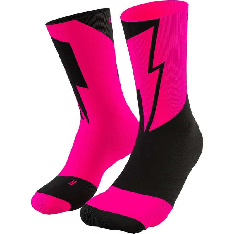 Two pink and black Dynafit socks with a lightning bolt pattern, photographed from below.