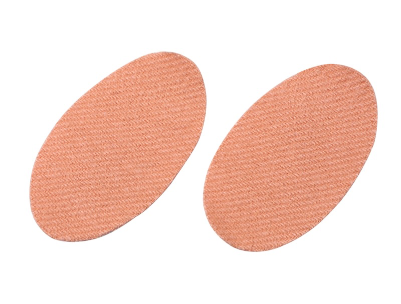 Zwei hellbraune, ovale Sidas Foot Protector Verbände auf weißem Hintergrund.