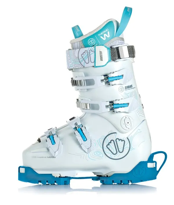Chaussure de ski blanche avec semelle antidérapante en caoutchouc bleu dans le profil, vue latérale.