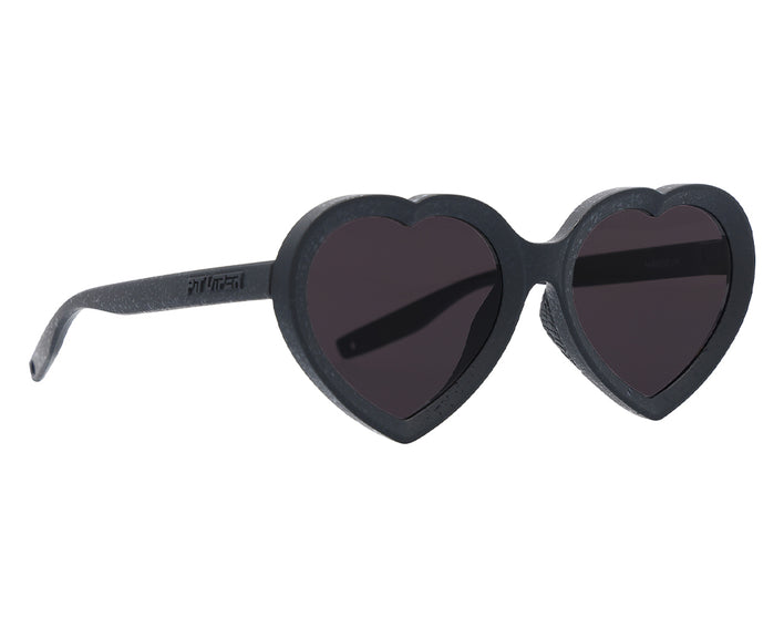 Lunettes de soleil noires en forme de cœur "The Admirer The Blacking Out" vues de profil.