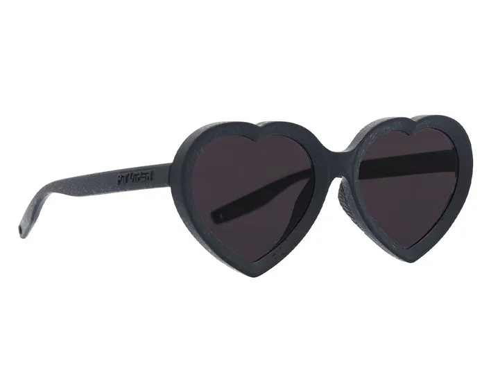 Occhiali da sole neri a forma di cuore "The Admirer The Blacking Out" in vista laterale.