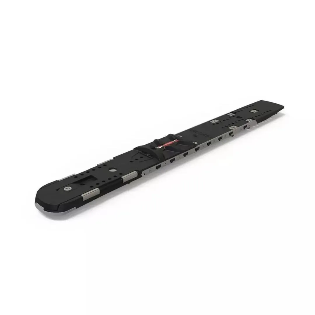 Black ski touring binding on a white background, with holes, straps and red details.