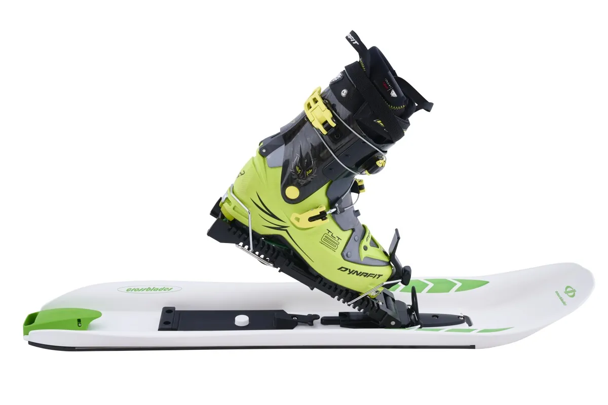 Crossblades Hardboot: Yellow ski boot is mounted on a white Crossblades.