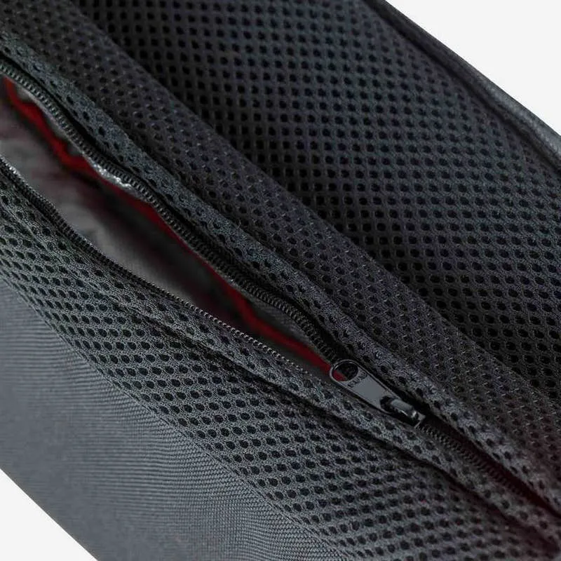 Photo de détail de la ceinture Rossignol Nordic Thermo Belt, montrant la fermeture éclair et la structure du filet.
