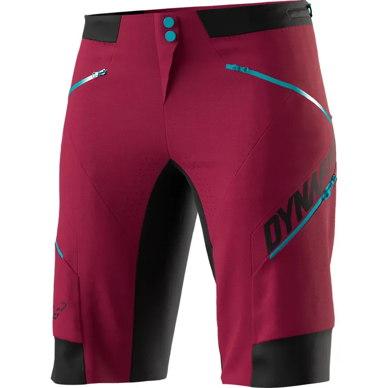 Beet Red Dynafit Ride Dynastretch shorts for women. The shorts have zippered pockets and blue accents.