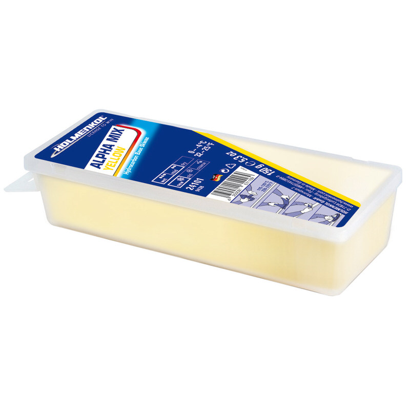 Gelbes Holmenkol Alphamix Skiwachs in einer transparenten Kunststoffverpackung.